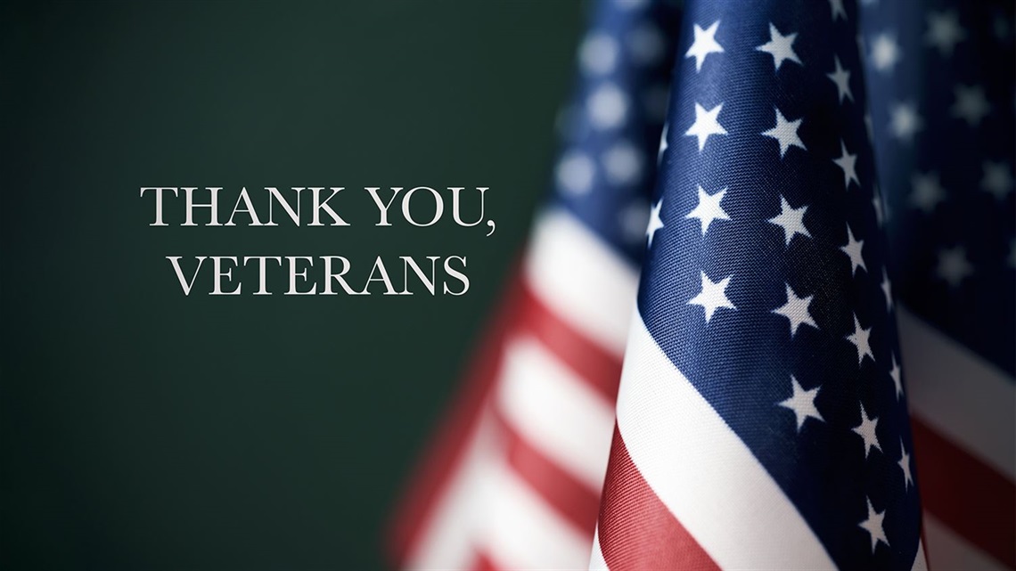 Thank-you-Veterans-message-on-green-background-with-American-flag.jpg