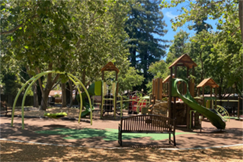 Willow Oaks Park plaground with bench in foreground