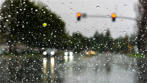 lights through rainy windshield