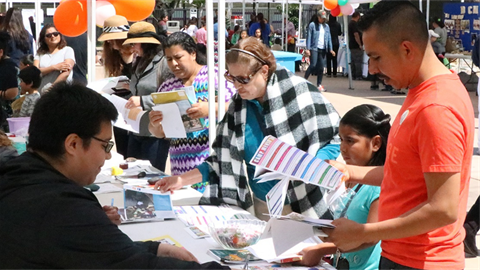 people at tables in public