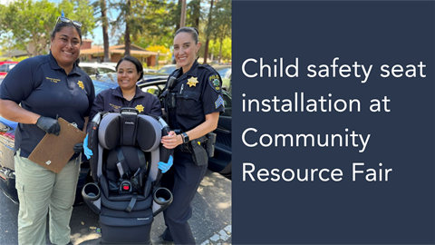 Child safety seat installation at Community Resource Fair