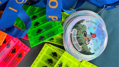 Bike Month pins and tags