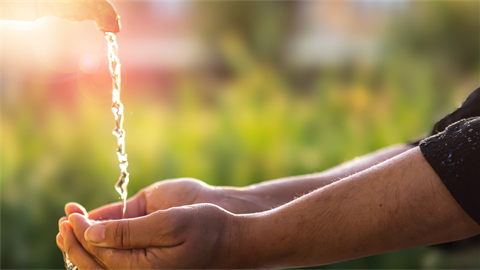 Water pouring into hands