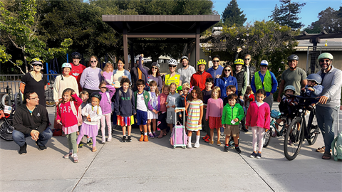 Laurel school group of adults and children with bikes