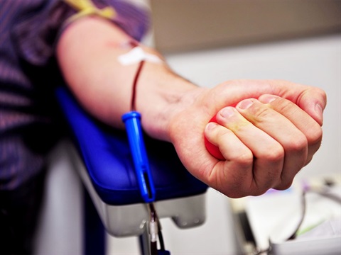 Blood-donor-squeezes-stress-ball-during-donation.jpg