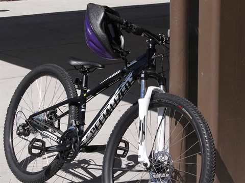Bike-and-helmet-left-unattended-next-to-support-beam