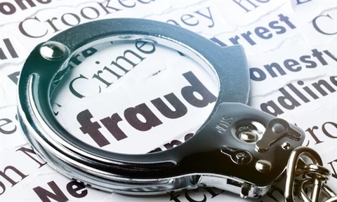 Fraud w handcuffs.jpeg