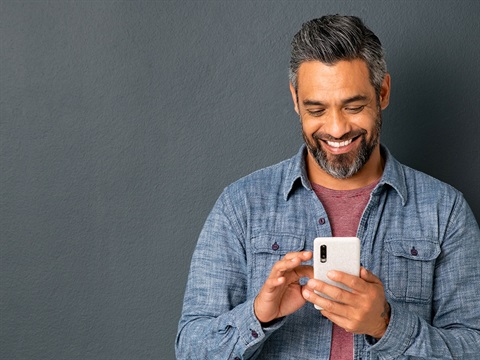 Man-uses-mobile-phone.jpg
