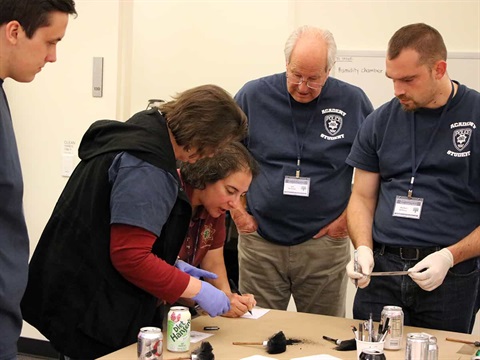 community-police-academy-students-crime-lab-class-dusting-for-fingerprints
