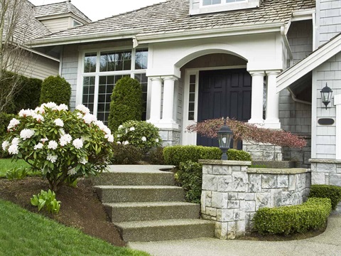 Crime-Prevention-Through-Environmental-Design-program-house-with-trimmed-bushes-security-lights-and-other-safety-design-aspects