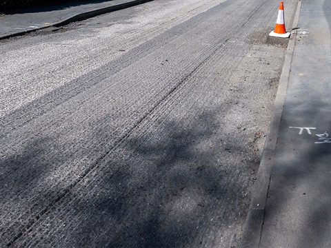 rough-asphalt-street-prepared-to-be-resurfaced.jpg