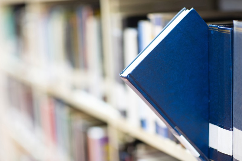 blue library book on shelf